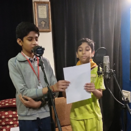 Kids singing in the studio make a music